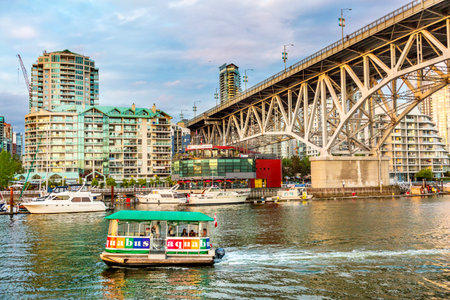 Granville Island Bridge Ferry Yachts Apartment Buildings Vancouver British Columbia Canadaのeditorial素材