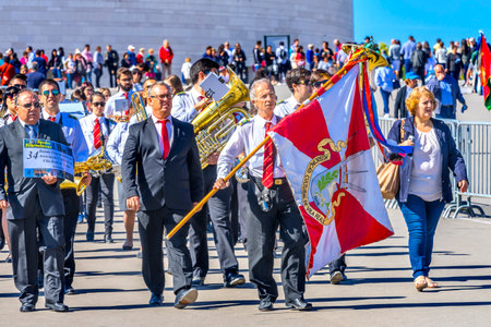 Pilgrims Believers Banner 100th Anniversary Apparations Basilica of Lady of Rosary Fatima Portugal. Church created on site where three Portuguese Shepherd children saw Virgin Mary of the Rosary Basilica created in 1953.のeditorial素材