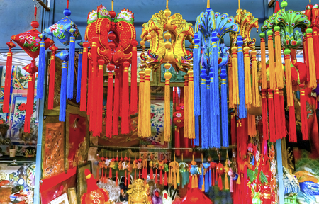 Blue Red Yellow Chinese New Year Silk Decorations Panjuan Flea Market  Decorations Beijing China.  Panjuan Flea Curio market has many fakes, replicas and copies of older Chinese products, many ancient.の写真素材