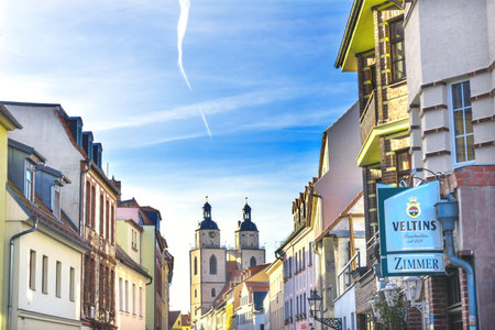 Colorful Street Restaurant Saint Mary's City Church Stadtkirche Lutherstadt Wittenberg Germany. Martin Luther's church. Founded in 1187, restored in 1900s.のeditorial素材