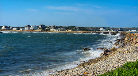 Wave Crash Stony Beach Westport Point Massachusetts Buzzards Bay Atlantic Ocean.  Waves crashing on rocks, sprayの写真素材
