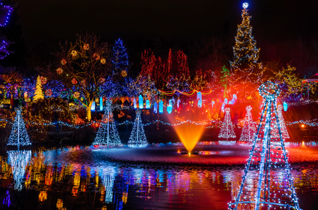 Blue Red Christmas Trees Lights Reflection Lake Van Dusen Garden Vancouver British Columbia Canadaの写真素材