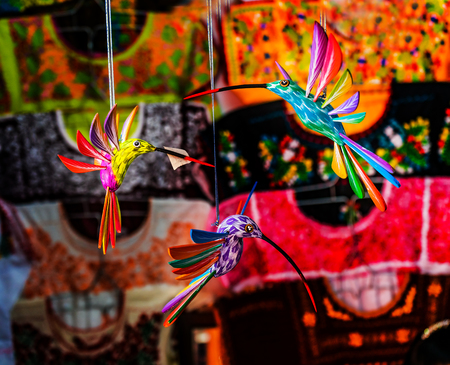 Colorful Wooden Hummingbirds Textiles Handicrafts Red Blue Pink Yellow Oaxaca Mexico.の写真素材