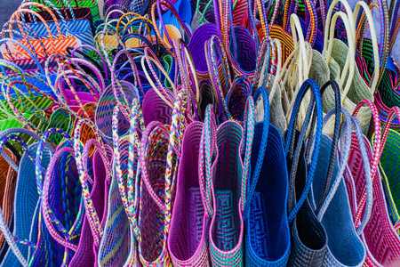 Colorful Straw Baskets Handicrafts Red Blue Pink Yellow Oaxaca Mexico.の写真素材