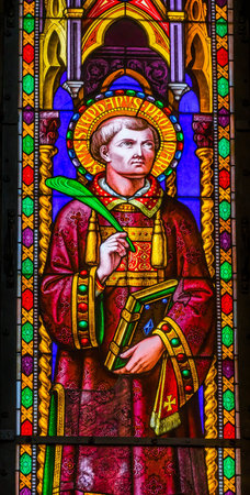 Saint Stephen Protomartyr First Christian Martyr Stoned to Death Stained Glass Baptistery of Saint John Piazza del Miracoli Cathedral Pisa Tuscany Italy. Completed in 1363.のeditorial素材