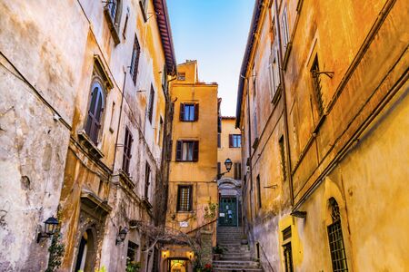Narrow Roman Street Restaurant Wine Rome Italy.の写真素材
