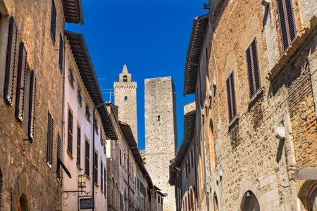 Medieval Narrow Street Buildings Cuganensi Towers San Gimignano Tuscany Italyの写真素材