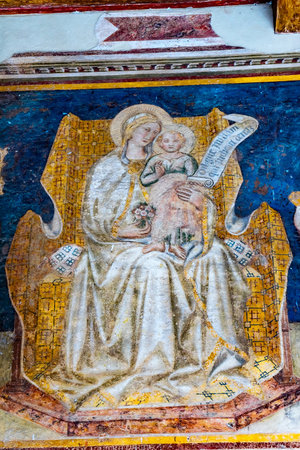 Madonna and Child Between Saints Gregory and Gimignano Fresco by Taddeo di Bartolo Outside San Gimignano Italy Fresco done in the early 1500s.のeditorial素材