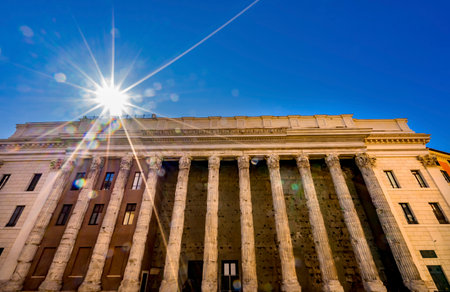 Temple of Hadrian Sun Rays Columns Colonnade Now Stock Exchange Rome Italy. Temple built 145 AD.のeditorial素材