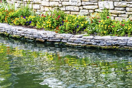 Colorful Flowers Reflection River Walk San Antonio Texas. 15 Mile River Walk created in the 1960s to deal with flood problem.の写真素材