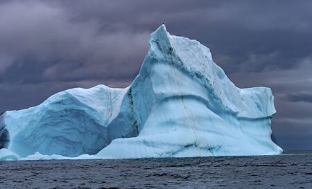 Floating Blue Iceberg Sea Water Charlotte Bay Antarctic Peninsula Antarctica.  Glacier ice blue...