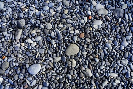 Peebles Reynisfjara Black Sand Beach South Shore Iceland.  Sand is black obsidian