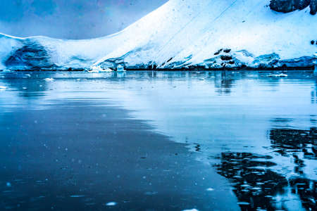 Blue Glacier Snow Mountains Paradise Bay Skintorp Cove Antarctica. Glacier ice blue because air...