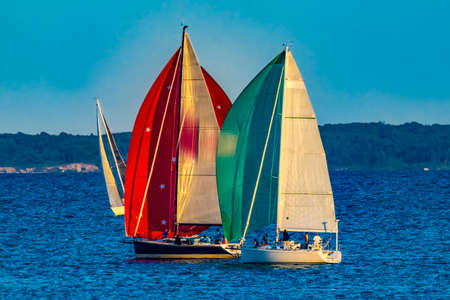 Colorful Sailboats Spinnakers Racing Padanaram Harbor  Buzzards Bay Dartmouth Masschusetts.の写真素材