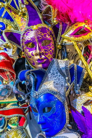Traditional Colorful Blue Purple Venetian Masks Venice Italy Used since the 1200s for Carnival. Masks allowed the Venetians to do what was illegalの写真素材