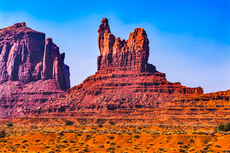 Colorful Sitting Hen Butte Rock Formation Canyon Face Cliff Desert Monument Valley Utah.
