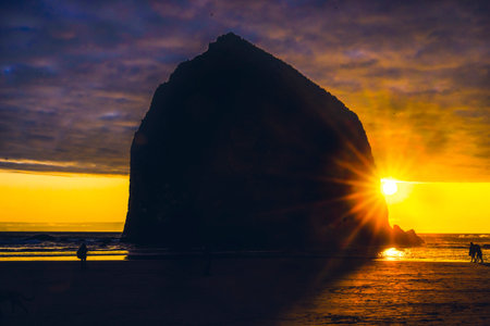 Colorful Sunset Haystack Rock Sea Stack Canon Beach Clatsap County Oregon.  Orginally discovered by Clark of Lewis Clark in 1805の写真素材