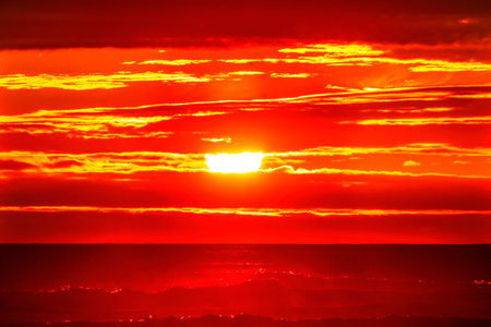 Sun Colorful Red Orange Sunset Pacific Ocean Coastline Canon Beach Clatsap County Oregon.  Amazing Sunsets at Canon Beachの写真素材