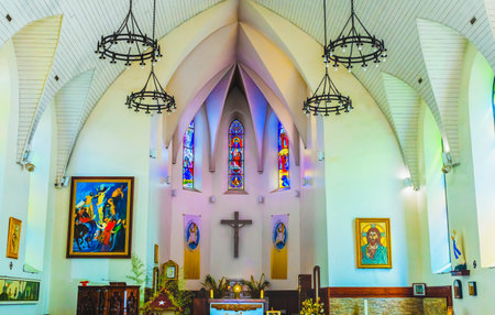 Colorful Altar Stained Glass Basilica Notre Dame Cathedral Papaeete Tahiti French Polynesia.  Words say Merciful Like the Fatherのeditorial素材