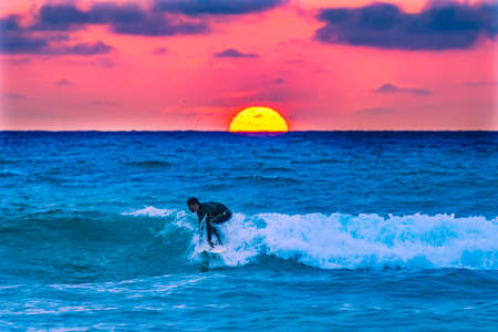 Surfers Surfing Sunset La Jolla Shores Beach San Diego Californiaの写真素材