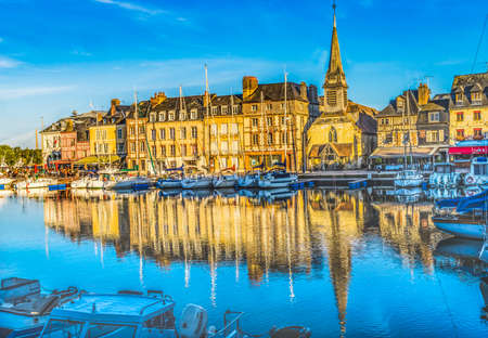 Colorful Marina Boats Yachts Waterfront Reflections Stores Restaurants,  Inner Harbor Honfluer France.  Honfluer is famous for its reflections, which inspired Monetの写真素材