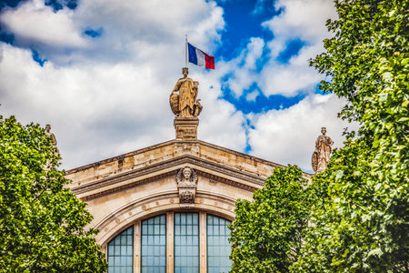 Gare du Nord North Train Station Flag Statue Building Paris France. Built in 1860s, one of six railroad stations in Paris Busiest railway station in Europeのeditorial素材