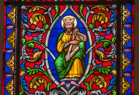 Colorful King David Lyre Musical Instrument Stained Glass Basilica Bayeux Cathedral Our Lady of Bayeux Church Bayeux Normandy France. Church consecrated in 1077のeditorial素材