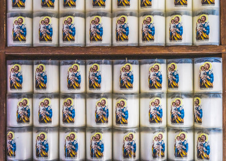 Saint Joseph Candles Basilica Saint Catherine Church Honfluer Normandy France. Saint Joseph was the father of Jesus.  Candles say "Pray for Us".のeditorial素材