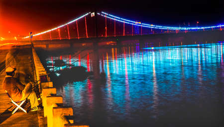 Fishing Hun River Jiangqun Qiao General Bridge Fuxin City Liaoning Province China Night Lightsの写真素材