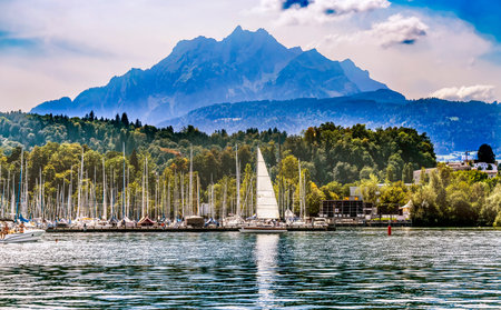 Colorful Swimmer Motorboat Lake Lucerne Mount Pilatus Sailboats Boats Harbor Buildings Lucerne Switzerlandの写真素材