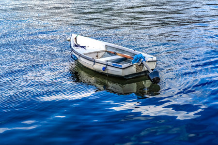 Colorful White Rowboat Blue Water Reflection Abstract Background Patterns Harbor  Dartmouth Devon England.の写真素材