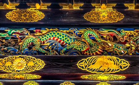 Coloful Ornate Dragon Wooden Carving Karamon Gate Nijo Castle Kyoto Japan. Completed in 1626 by Tokugawa Shoguns. In 1867 Castle returned to Emperor. Chrysanthemum is a symbol of Imperial Court.の写真素材