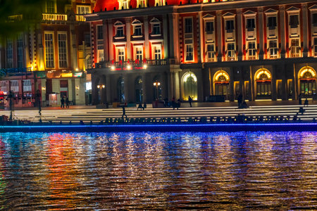 Colorful Jinwan Plaza Cultural  Square Tourist Night Illuminated Bridge Hai River Water Reflection Tianjin China.の写真素材