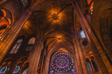 Interior Stained Glass Old Notre Dame Cathedral Paris France.  Original Notre Dame Before the Fire in 2019. Reopened in 2025 after cleaning. Notre Dame was originally built between 1163 and 1250 AD.の写真素材