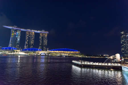 Night photo of Merlion Monument and Marina Bay sands in Singapore central business district, Singapore, April 14 2018のeditorial素材