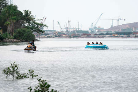 Beach water sports tubing with tourist being pulled by jetski in a beach in batam indonesia, Indonesia, May 4 2019のeditorial素材