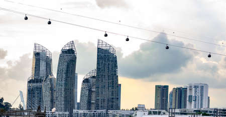 Harbour Front buldings and bay with cable cars and large ships, Singapore, March 30, 2020のeditorial素材