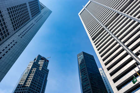 SINGAPORE - MAR 30: View of skyscrapers in Marina Bay on March 30, 2020 in Singapore. Singapore is the world's fourth leading financial centre.  UOB Building and One Raffles placeのeditorial素材