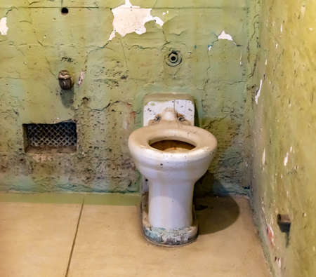 Broken rusty and dirty sink and toilet bowl from a cell at Alcatraz Prison San Francisco California...