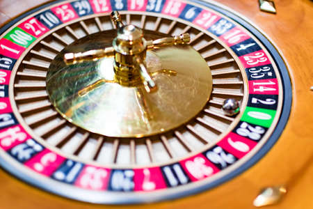 Casino theme. image of casino roulette, poker game. the drum from roulette. that our life-game. Luxury roulette in a casino. roulette wheel and the ball in the winning number zero. close up imageの写真素材