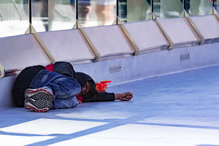 Homeless Person sleeping on a bridge near Hard Rock Cafe Las Vegas Strip, Las Vegas Nevada USA, March 30, 2020のeditorial素材