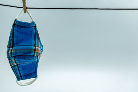 The cloth mask hanging on white