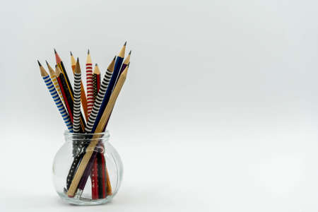 Pencils in a pencil bucket on white background. Back to school concept