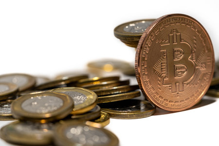 Stack of coins and a bitcoin. Crypto currency investment conceptの写真素材