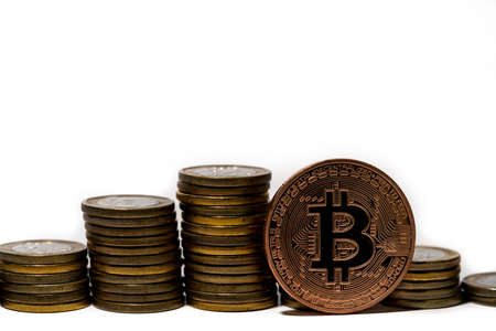 Stack of coins and a bitcoin. Crypto currency investment concept