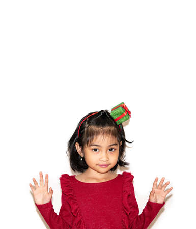 Portrait of candid lovely child girl enjoy free time weekend walk touch hand skirt wear good look clothes isolated over white color backgroundの写真素材