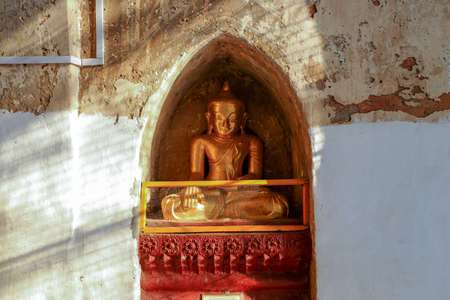 Ancient golden buddha statue inside Thatbyinnyu temple in Bagan,Myanmarの写真素材