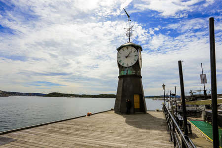 the clock tower at oslo bay, norwayの写真素材