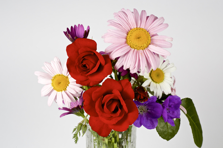Various flowers on the tableの写真素材