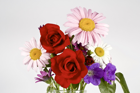 Various flowers on the tableの写真素材